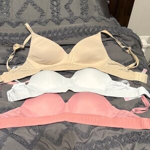 Victoria's Secret Beige, White, and Pink Bras